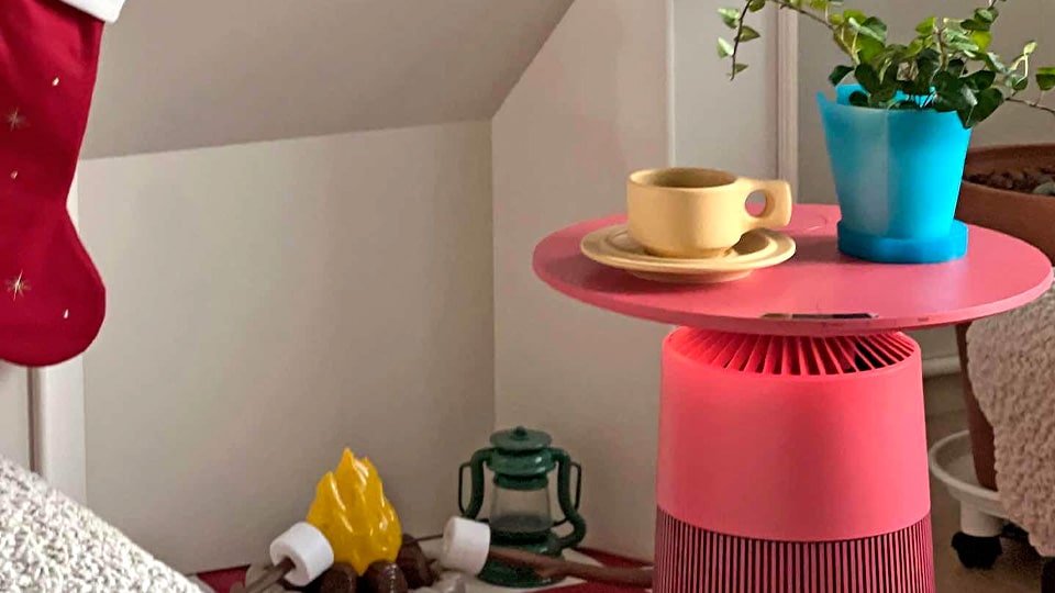 Products are placed in a room with colorful interiors. Coffee cups and pots are placed on top, serving as an interior accessory.
